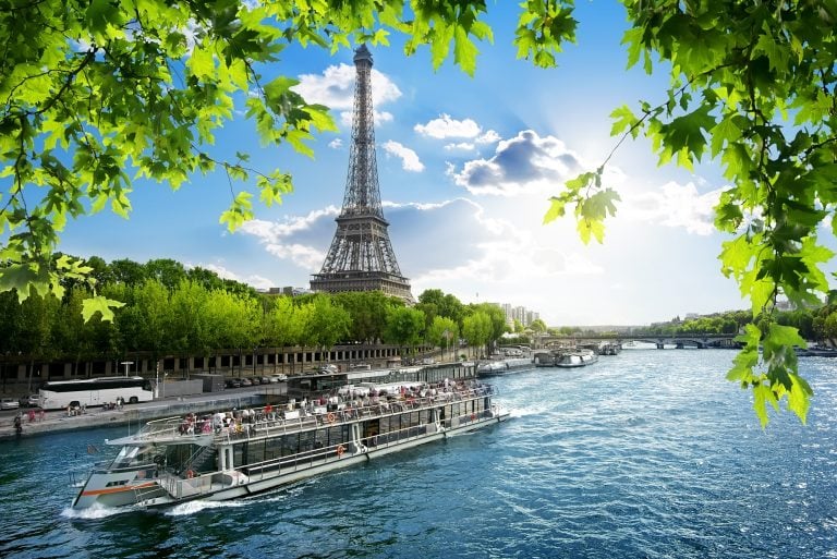 Boat trip on Seine with the view on Eiffel Tower in Paris, France